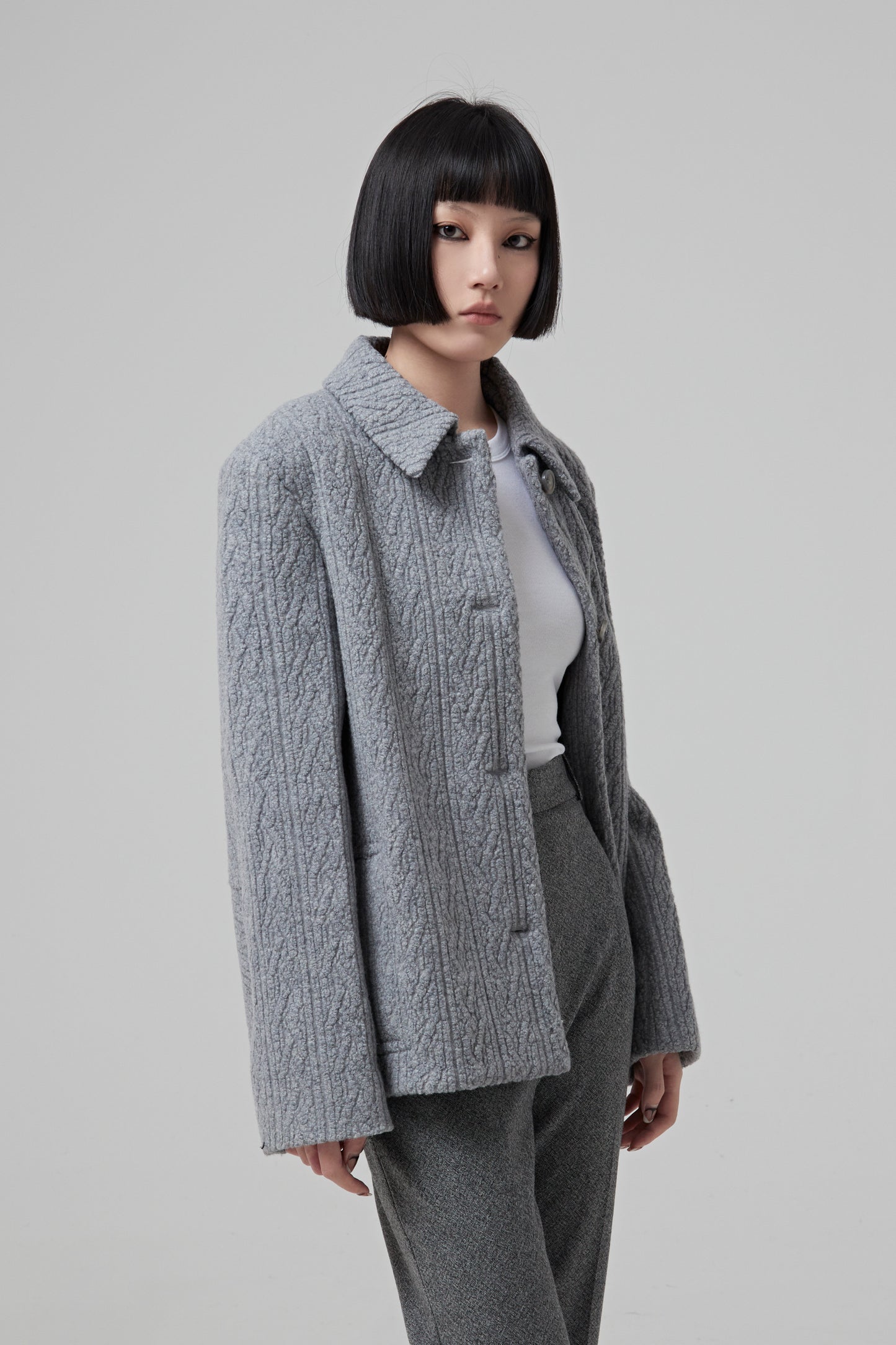 SINGLE BREASTED GREY JACQUARD JERSEY JACKET BUTTONED IN THE FRONT