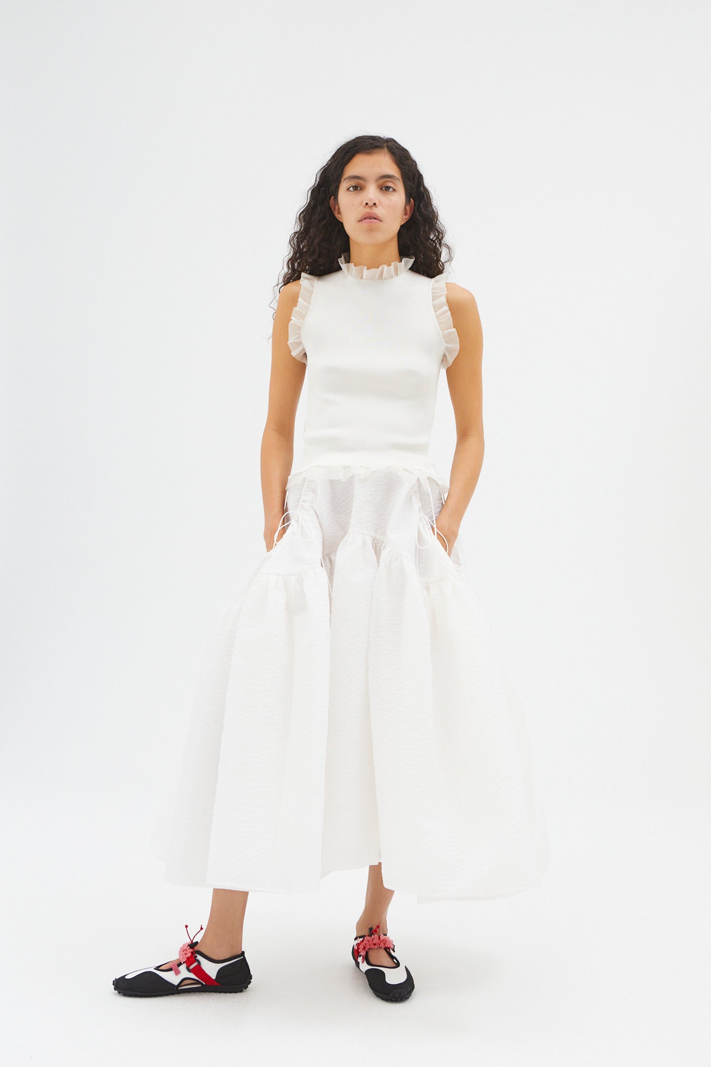 SLEEVELESS TOP WITH RUFFLED DETAILS