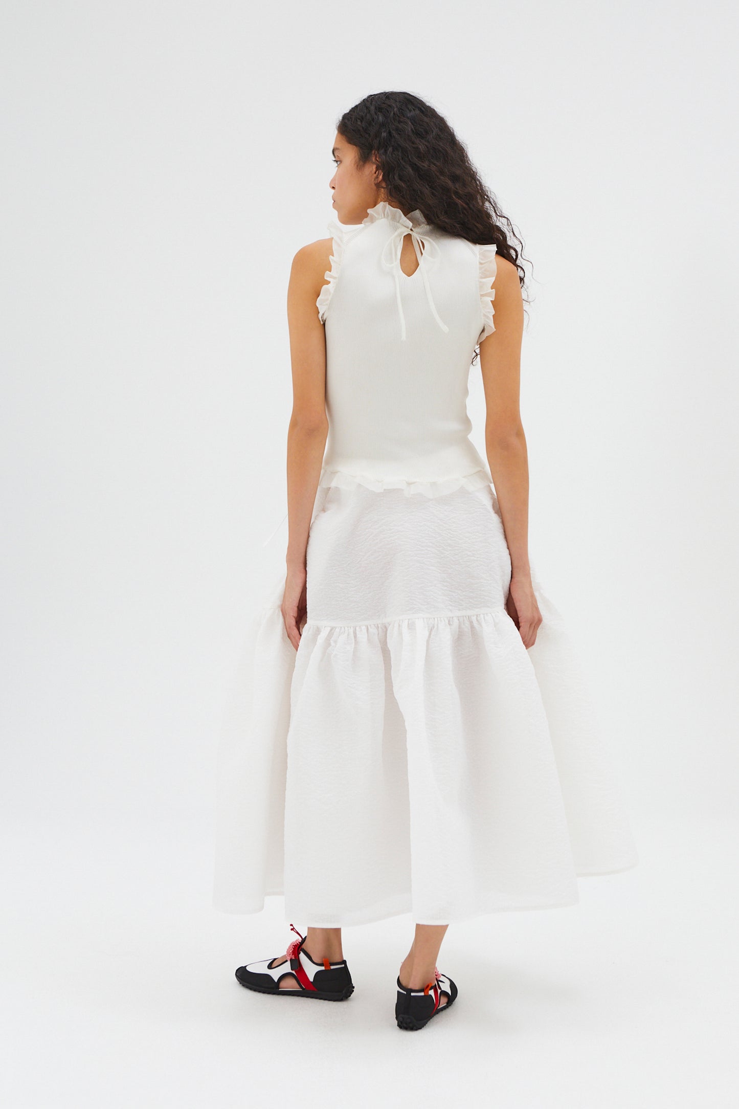 SLEEVELESS TOP WITH RUFFLED DETAILS