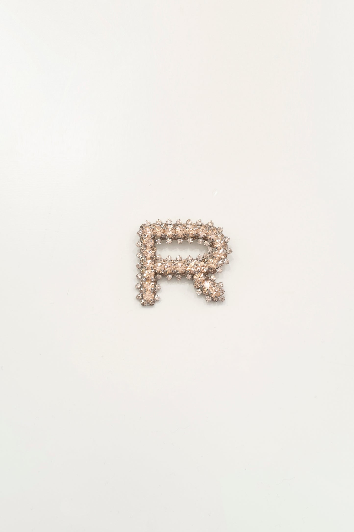BROOCH IN CRYSTALS AND METAL