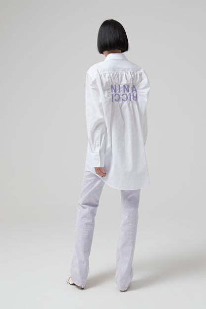 CRINKLED SHIRT WITH CONTRASTED EMBROIDERY ON THE BACK