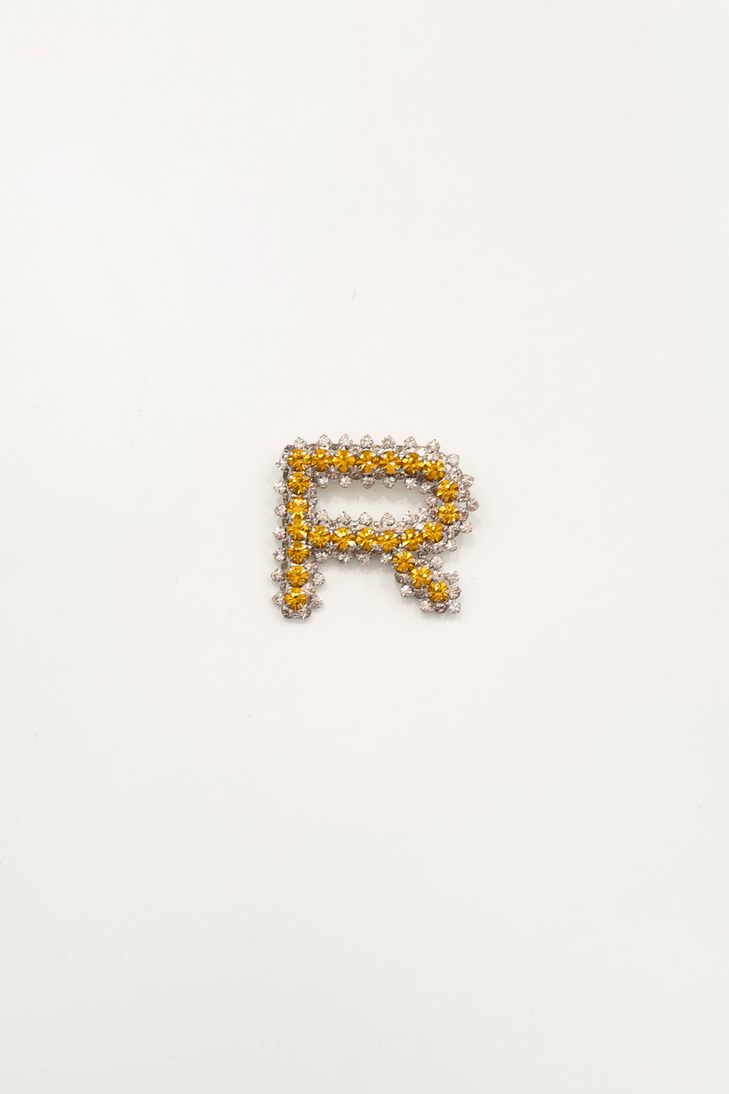 BROOCH IN CRYSTALS AND METAL